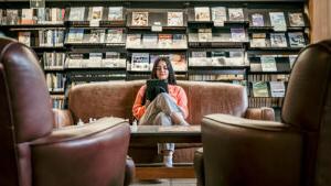 girl reading at paul smiths college library